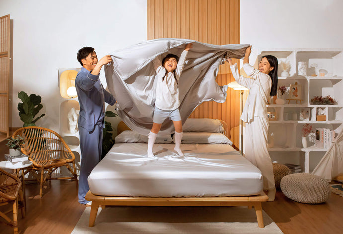 Family playing on Sonno nimbus cloud Bed Sheet in a Japandi Bedroom