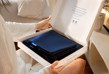 Woman unboxing Sonno navy blue Bed Sheet